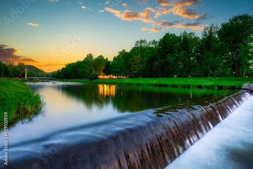 Fototapeta Naklejka Na Ścianę i Meble -  A beautiful sunset over the Vistula River in Ustron, Silesian Beskids. Poland
