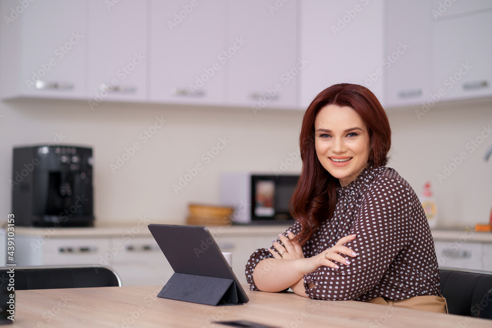 Caucasian business woman having a break with hot tea in the office. Hand holding white cup of coffee and checking e-mail or message today in the office Caucasian business woman having a break with hot tea in the office. Hand holding white cup of coffee and checking e-mail or message today in the office