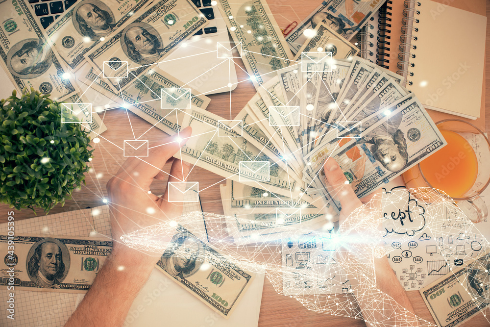 Multi exposure of envelop drawing hologram and USA dollars bills and man hands. Technology concept. Multi exposure of envelop drawing hologram and USA dollars bills and man hands. Technology concept.