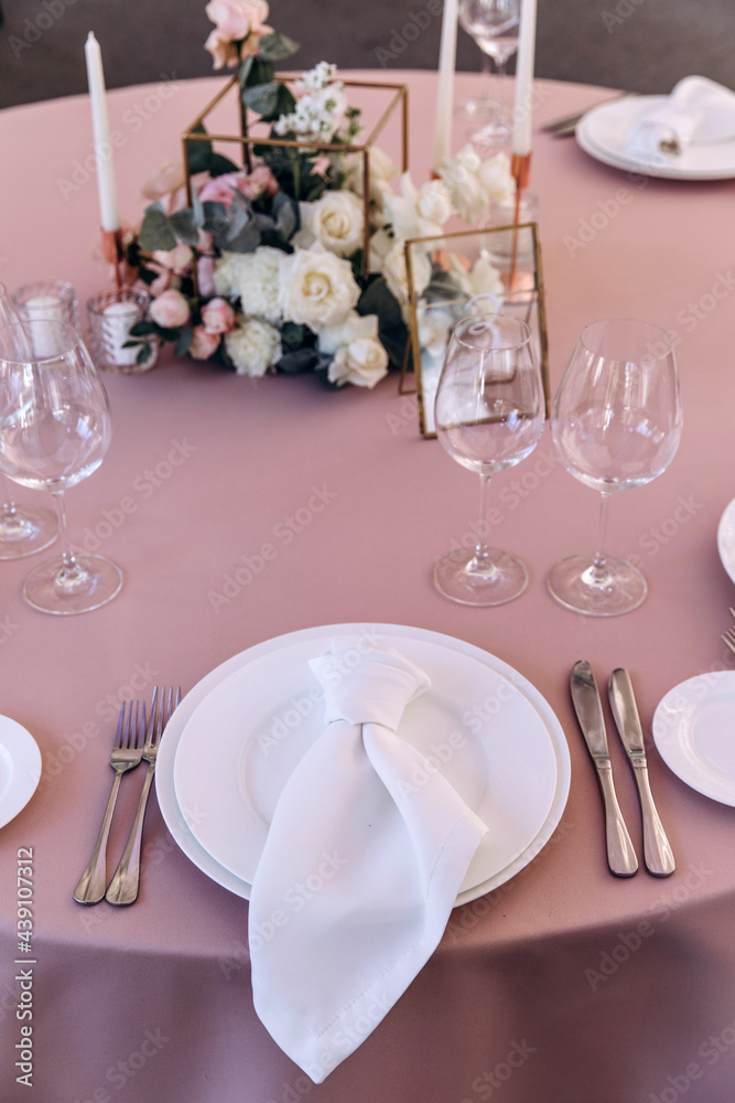 Cutlery on the table. Banquet and wedding table setting. Banquet accessories. Close-up. Cutlery on the table. Banquet and wedding table setting. Banquet accessories. Close-up.