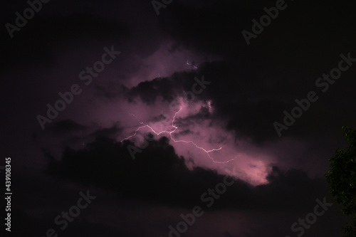 Nature lightning flash in cloudy dark rainy sky