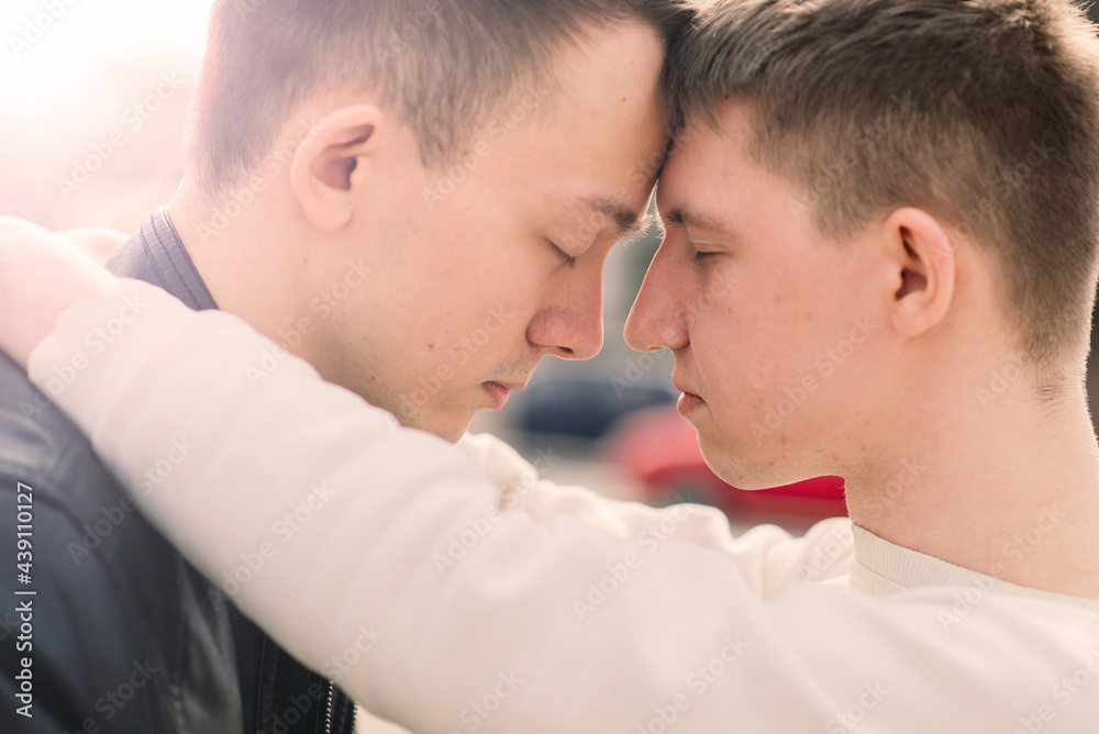 Gay couple walking in city centre, lifestyle Gay couple walking in city centre, lifestyle