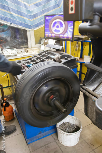 Car wheel repair in a tire workshop.