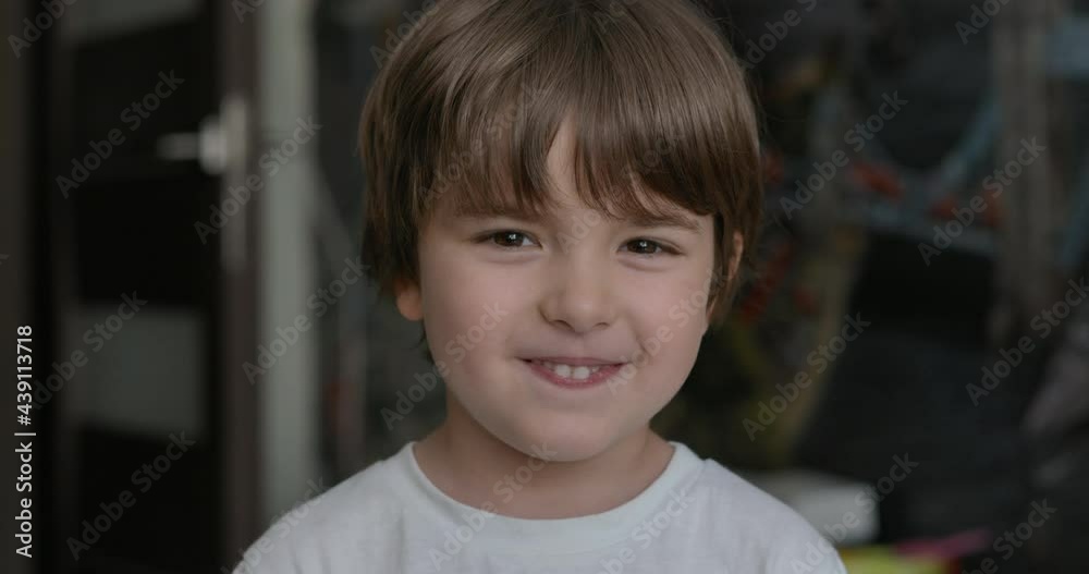 Close-up Portrait of Happy Little Child Bursting in Laugh. Kid Boy Laughs Indoors Closeup. Portrait of Little Boy Child Looking and Smiling to Camera. Face Funny Contemplative Kid. Slow Motion. Close-up Portrait of Happy Little Child Bursting in Laugh. Kid Boy Laughs Indoors Closeup. Portrait of Little Boy Child Looking and Smiling to Camera. Face Funny Contemplative Kid. Slow Motion.