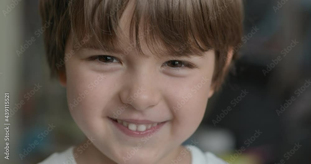 Close-up Portrait of Happy Little Child Bursting in Laugh. Kid Boy Laughs Indoors Closeup. Portrait of Little Boy Child Looking and Smiling to Camera. Face Funny Contemplative Kid. Slow Motion. Close-up Portrait of Happy Little Child Bursting in Laugh. Kid Boy Laughs Indoors Closeup. Portrait of Little Boy Child Looking and Smiling to Camera. Face Funny Contemplative Kid. Slow Motion.