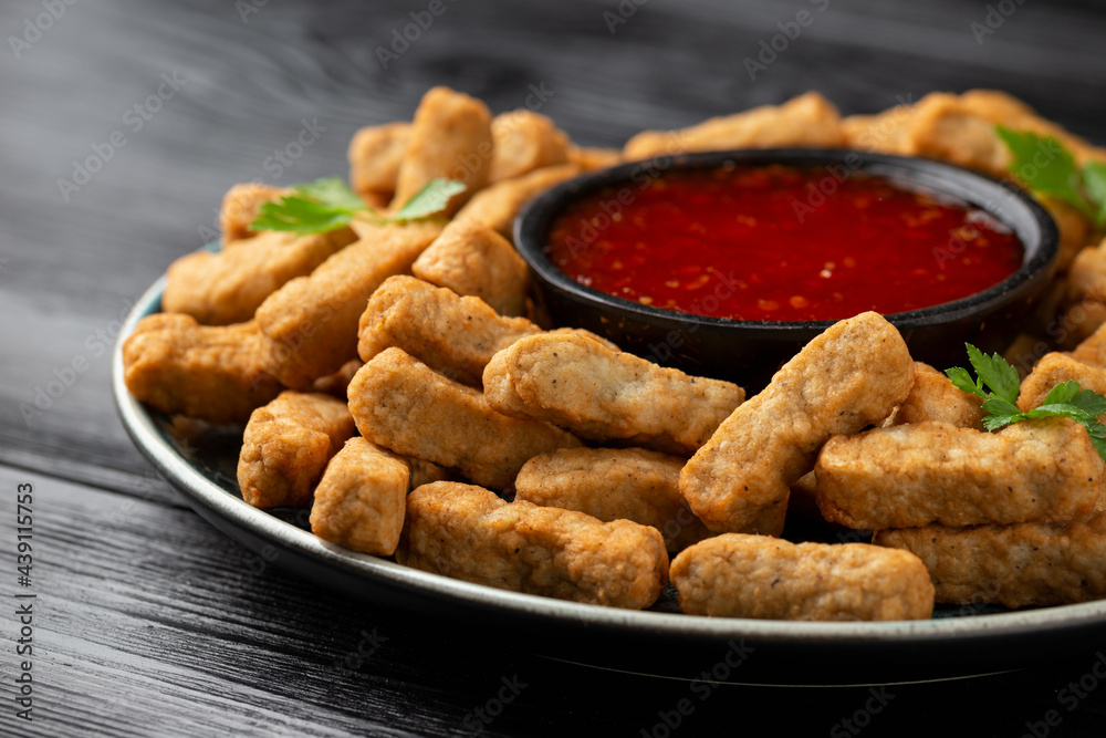 Party finger food southern style chicken breast bites served with sweet chilli sauce Party finger food southern style chicken breast bites served with sweet chilli sauce