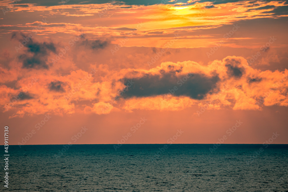 Colorful seascape and cloudscape over morning Black Sea waters, Bulgaria. Minimalistic feel. No people.