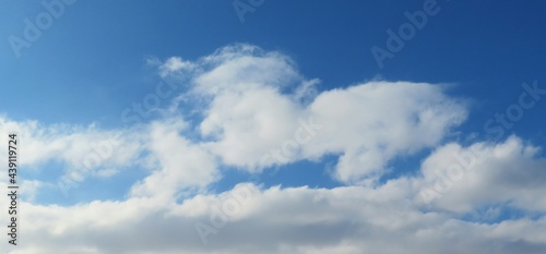 Panoramic view of blue sky with beautiful fluffy clouds, natural background