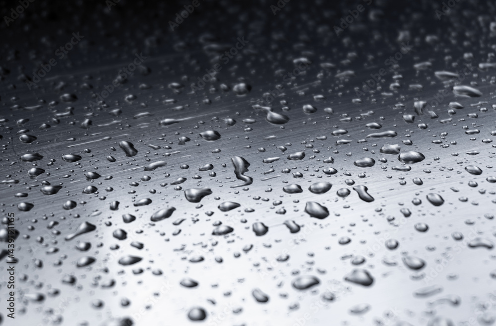 Many different drops of water on the metal surface Many different drops of water on the metal surface
