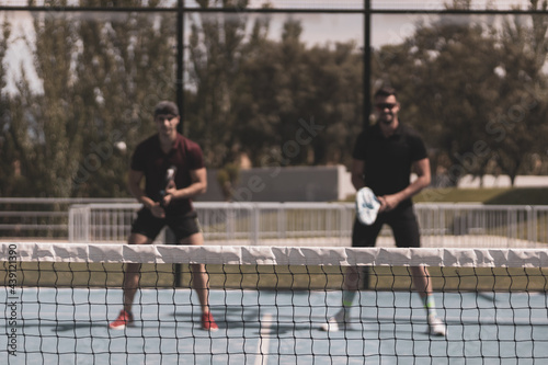 paddle tennis players playing a game