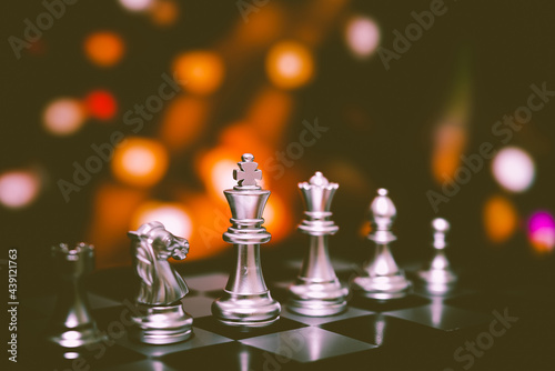 Closeup of chess characters on board games. to represent decision making in term of business strategy to find out the best solution to meet target objective and goal.  