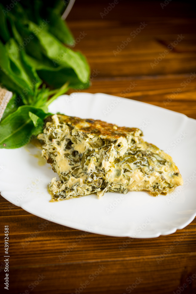 fried egg omelet with spring sorrel inside fried egg omelet with spring sorrel inside