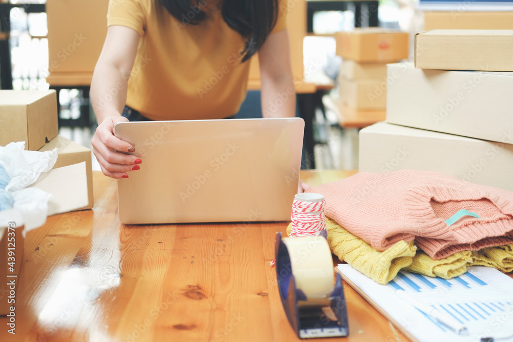 Online small business owner checking order. Online small business owner checking order.