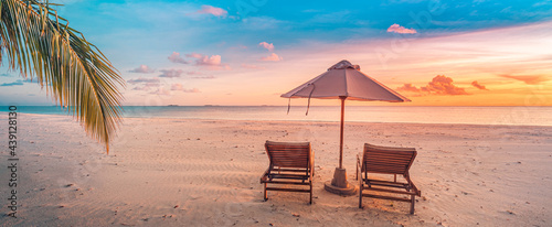 Panoramic beach. Chairs on the sandy beach near the sea. Summer holiday and vacation for luxury tourism. Inspirational tropical landscape. Tranquil scenery, relaxing beach, tropical landscape design © icemanphotos