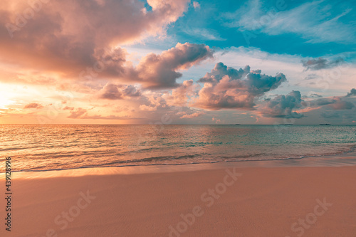 Fototapeta Naklejka Na Ścianę i Meble -  Closeup sea sand beach. Panoramic beach landscape. Inspire tropical beach seascape horizon. Orange and golden sunset sky calmness tranquil relaxing sunlight summer mood. Vacation travel holiday banner