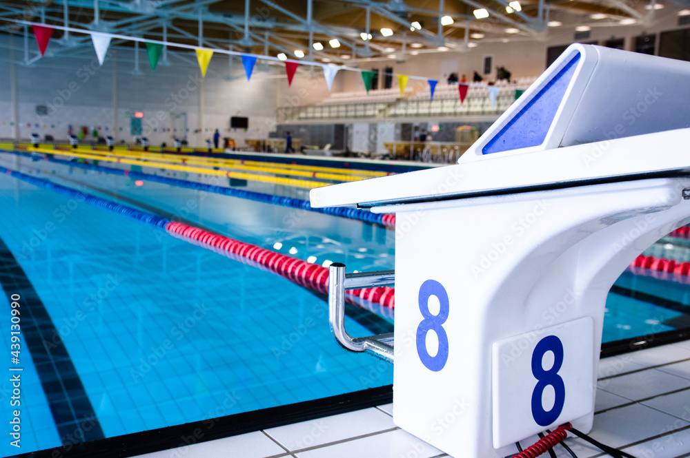 Aligned swimming starting block and platform with number Aligned swimming starting block and platform with number