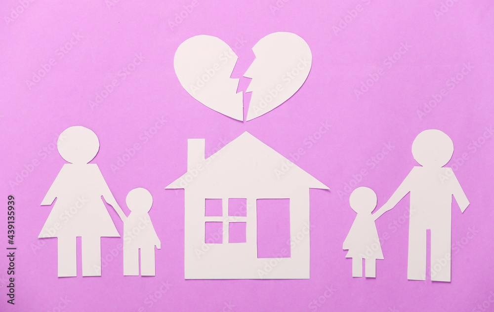 Broken family, divorce. Property division. Split paper family, house, heart on pink background Broken family, divorce. Property division. Split paper family, house, heart on pink background