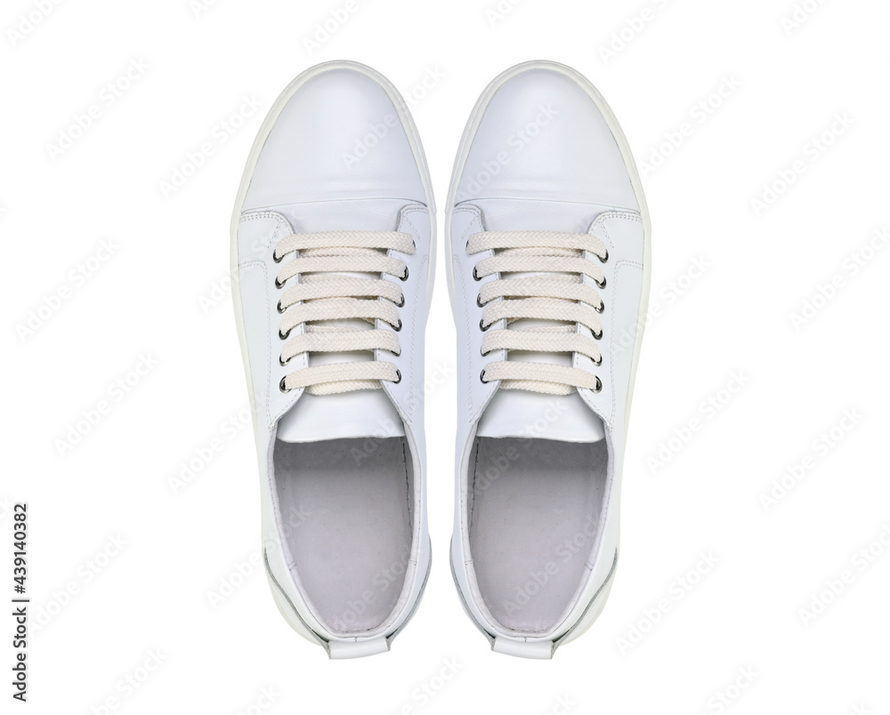 White pair of sneakers isolated on white background. View from above.