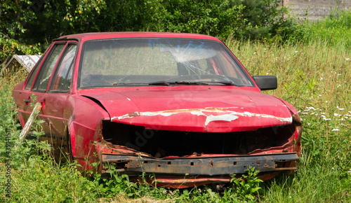 Old broken car in nature.