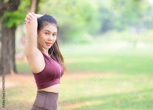 Beautiful Asian women exercise in the park every morning, It is a lifestyle for relaxation and good health of the body © ritfuse