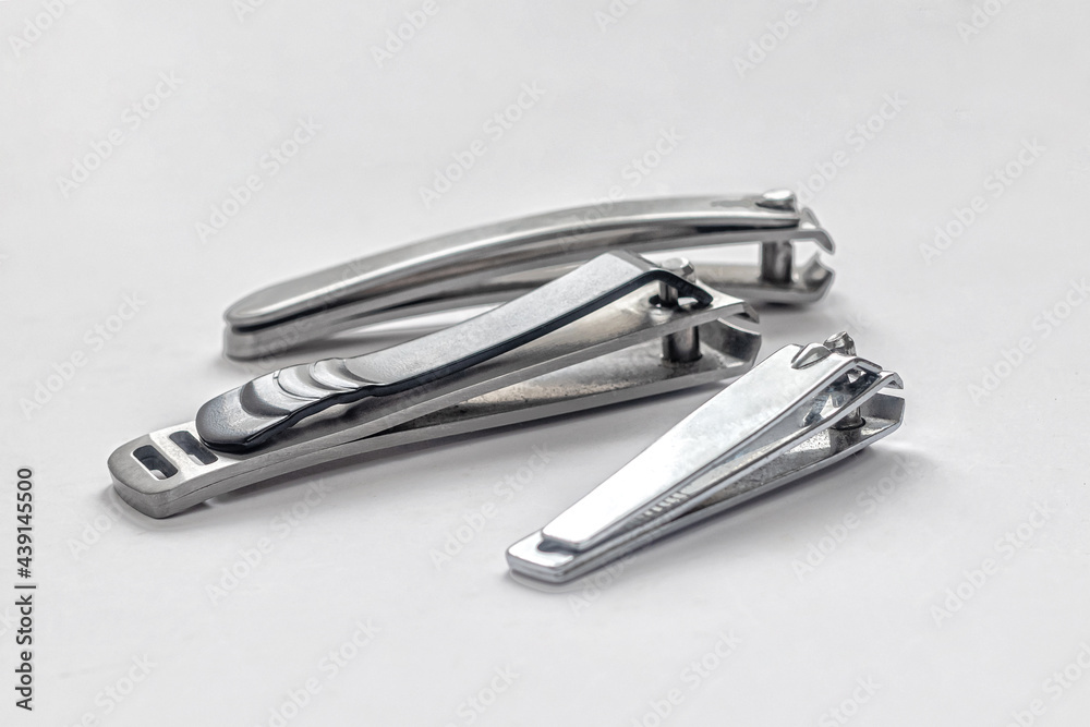 Multiple nail clippers on a white background Multiple nail clippers on a white background
