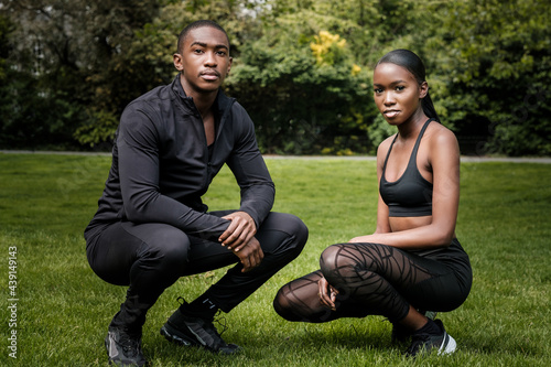 Black brother and sister twins posing outdoor in stylish sportswear. © Jorge Elizaquibel