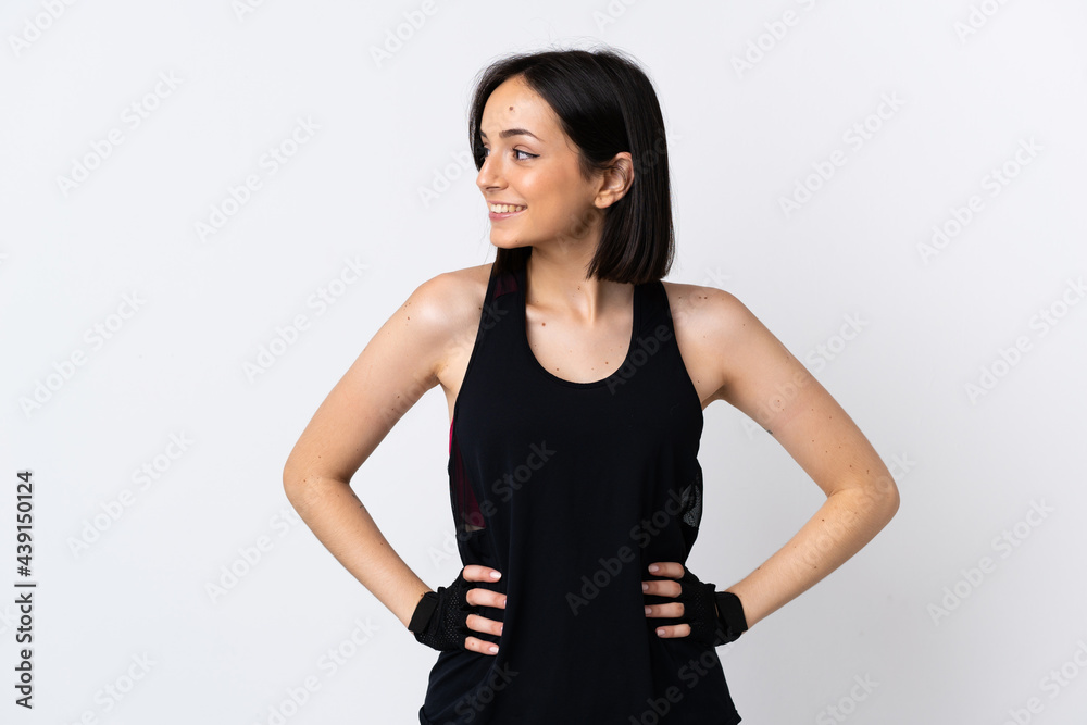 Young caucasian woman isolated on white background posing with arms at hip and looking side Young caucasian woman isolated on white background posing with arms at hip and looking side