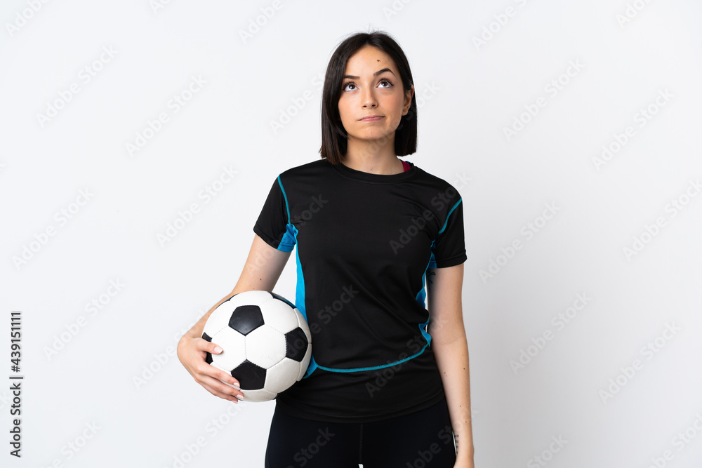 Young football player woman isolated on white background and looking up Young football player woman isolated on white background and looking up