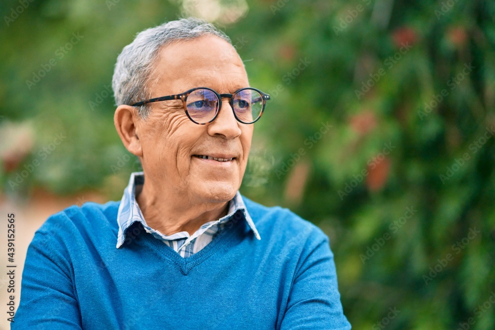 Senior grey-haired man smiling happy standing at the city. Senior grey-haired man smiling happy standing at the city.