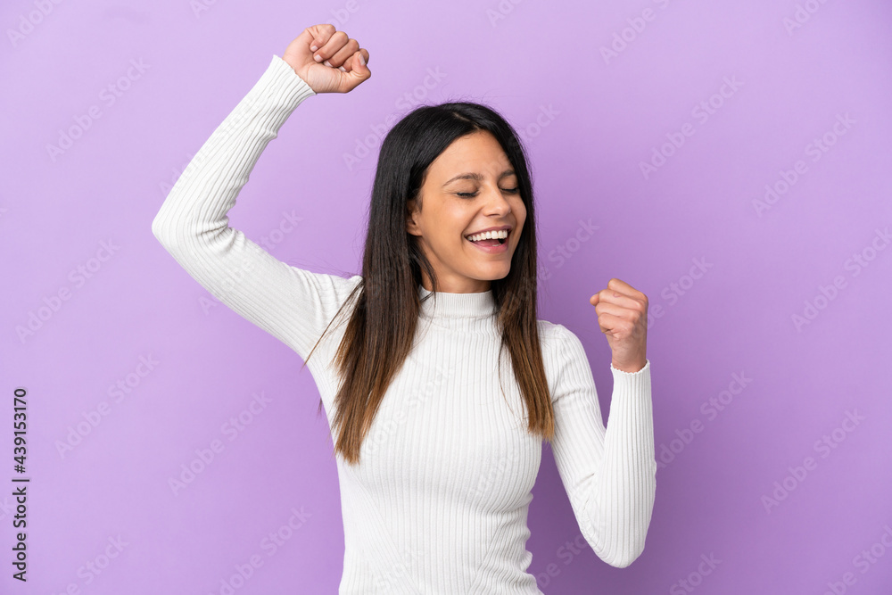 Young caucasian woman isolated on purple background celebrating a victory Young caucasian woman isolated on purple background celebrating a victory