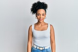 Young african american girl wearing casual style with sleeveless shirt with a happy and cool smile on face. lucky person.