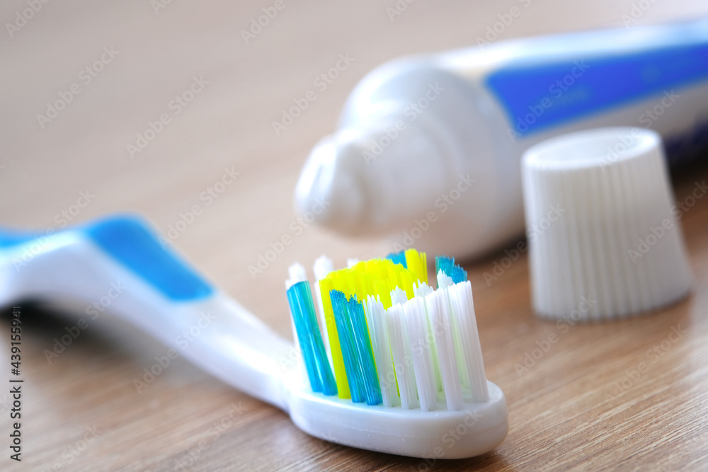 Toothbrush and toothpaste on the washstand shelf. The concept of oral hygiene. Eco-friendly accessories. Toothbrush and toothpaste on the washstand shelf. The concept of oral hygiene. Eco-friendly accessories.