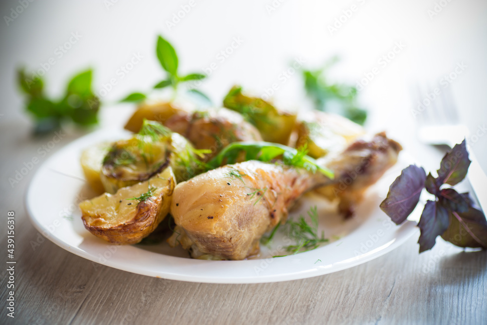 baked chicken leg with early potatoes and zucchini baked chicken leg with early potatoes and zucchini
