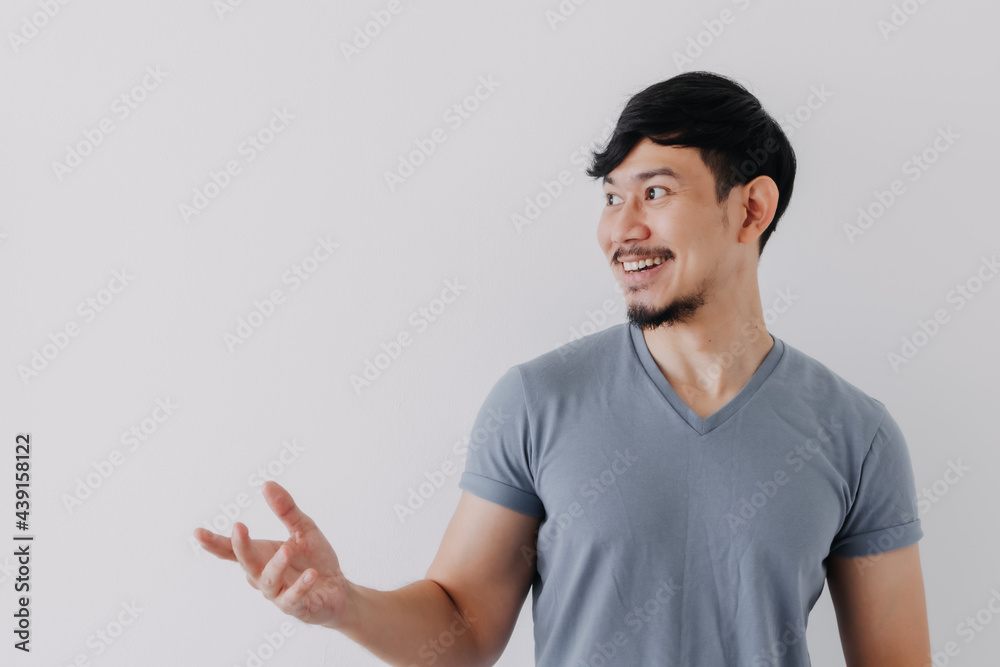 Smile and happy Asian man is proud to present and offer for an advertisement. Smile and happy Asian man is proud to present and offer for an advertisement.