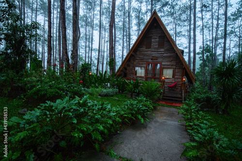 A frame triangle holiday house in the woods at night  peaceful weekend getaway in nature