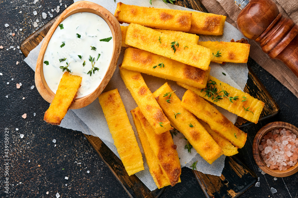 Homemade polenta chips fries with sea salt, parmesan, thyme, rosemary