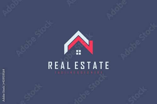 Real Estate Logo. White and Red Geometric Shapes House Symbol isolated on Blue Background. Usable for Construction Architecture Building Logo Design Template Element.