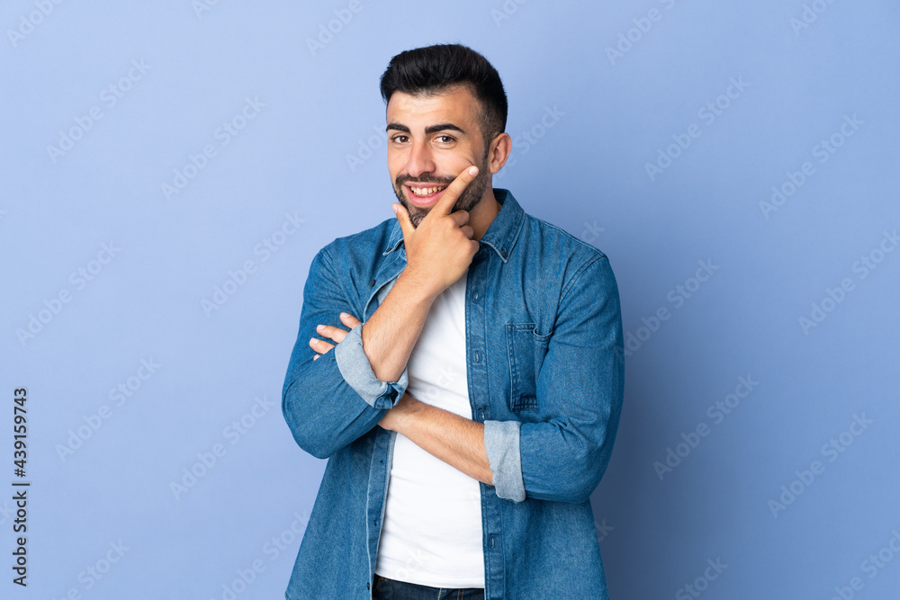 Caucasian man over isolated blue background happy and smiling Caucasian man over isolated blue background happy and smiling