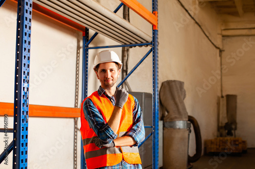 Portrait of young man member of factory staff