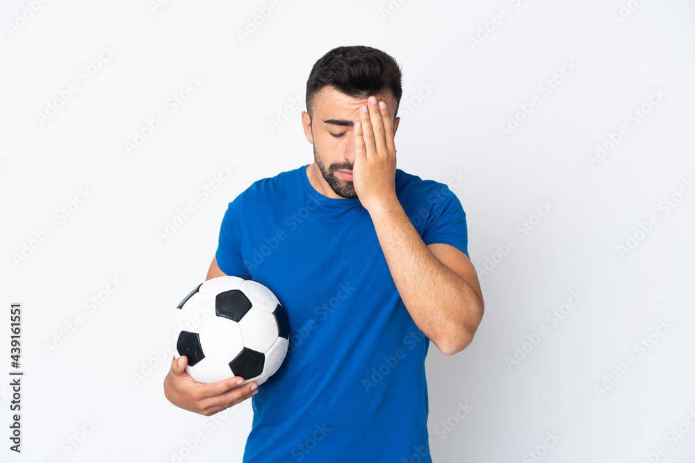 Handsome young football player man over isolated wall with tired and sick expression