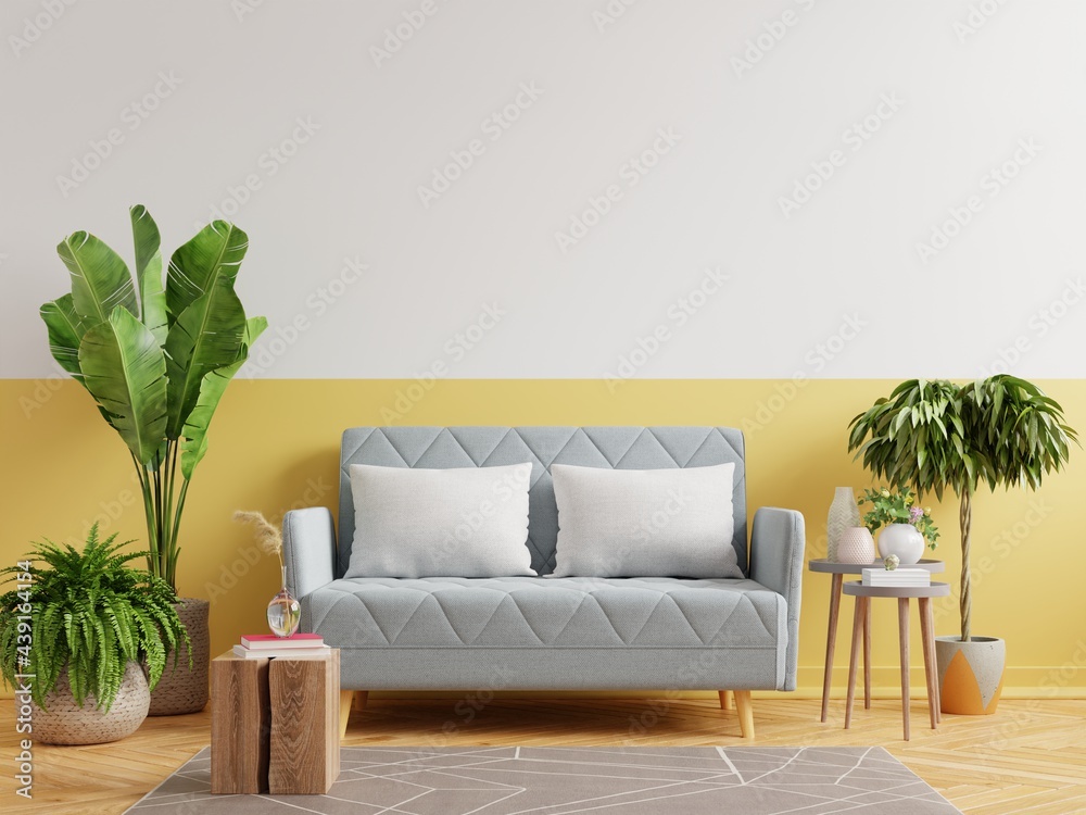Interior mockup yellow wall with gray sofa in living room.