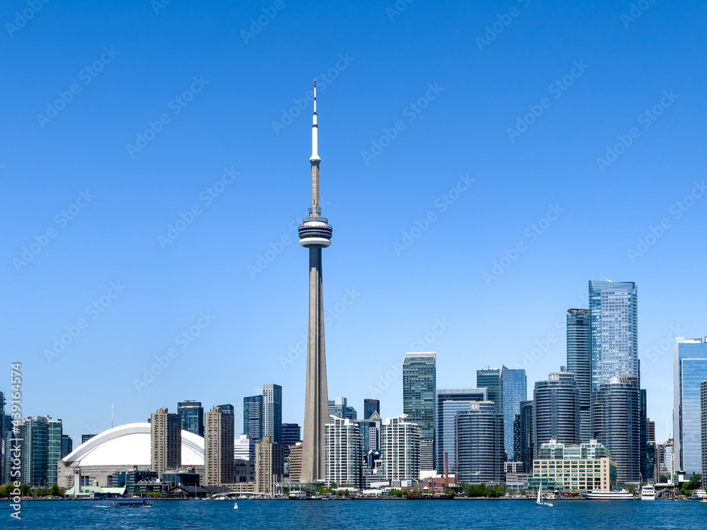 Toronto skyline with blue clear sky, Canada. All branding from buildings has been removed
