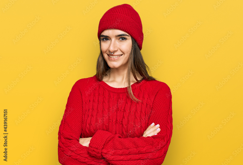Young hispanic woman wearing casual clothes happy face smiling with crossed arms looking at the camera. positive person.