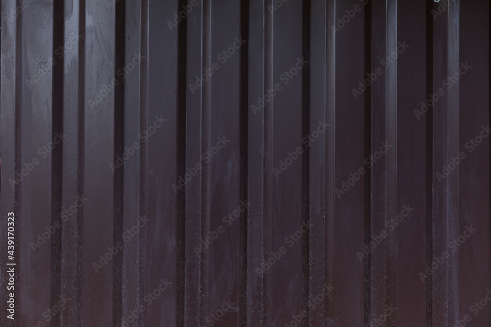 Texture of dirty dark brown iron fence. Iron sheet. Background. Space for text.
