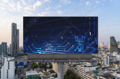 Glowing hologram of technological process on billboard, aerial panoramic cityscape of Bangkok at sunset. The largest innovative hub of tech services in Southeast Asia.