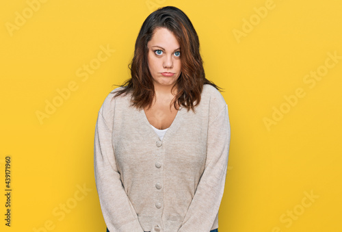 Young plus size woman wearing casual clothes depressed and worry for distress, crying angry and afraid. sad expression.