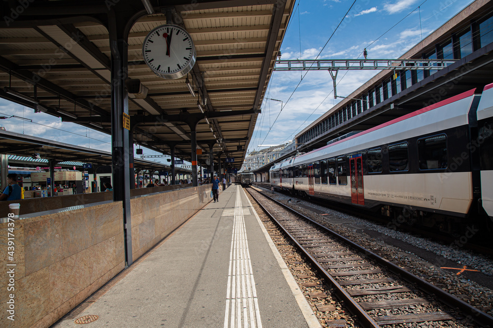 A train standing at railway station platform  in Europe