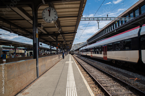 Fototapeta Naklejka Na Ścianę i Meble -  A train standing at railway station platform  in Europe