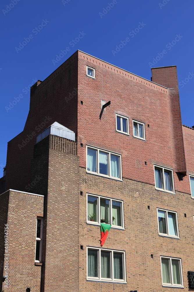 Amsterdam School of Architecture Building with Portuguese Flag Hanging from a Window in Amsterdam, Baarsjes District