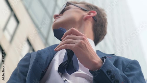 Worried nervous business man is waiting for someone photo